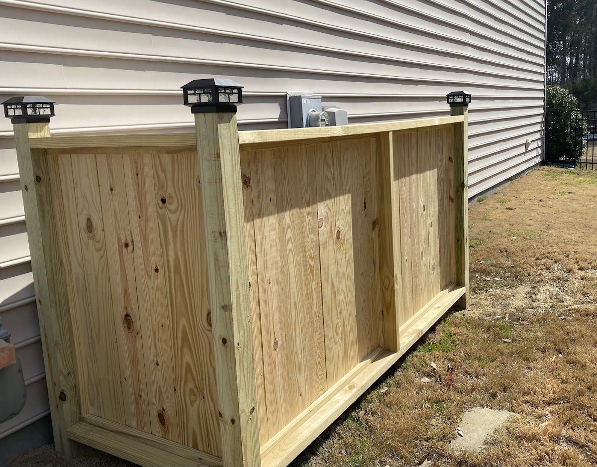 Custom wooden privacy fence with solar cap lights