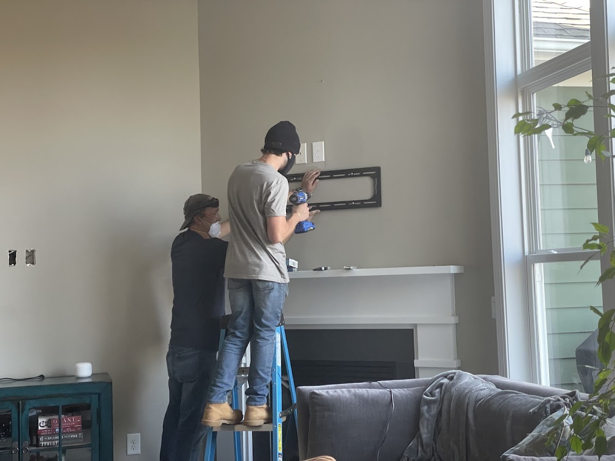 TV wall mount installation above fireplace