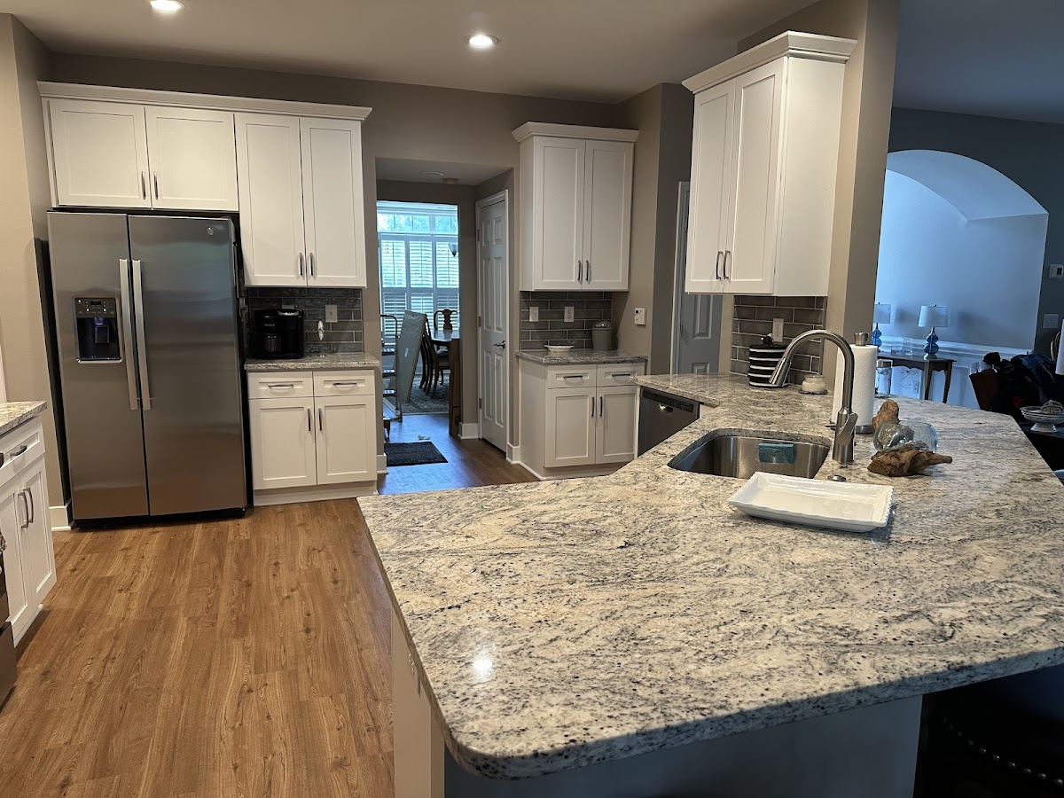 Full kitchen renovation with island and subway tile