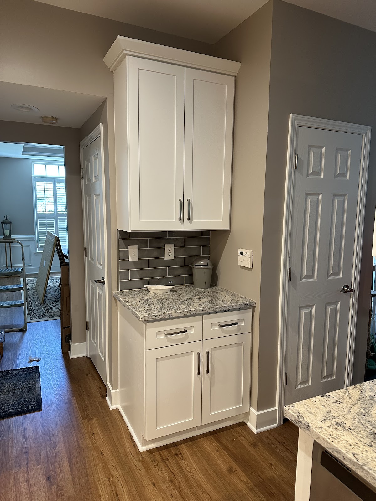 Custom kitchen renovation by LKN Home Repair featuring white shaker cabinets and granite countertops